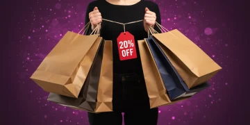 2025 Apparel Discount Playbook: 20% Off Every Purchase Person happily holding shopping bags with 20% off tags, symbolizing successful apparel discount strategies for 2025.