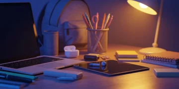 Modern electronics for back-to-school, featuring a laptop, tablet, and headphones on a desk.